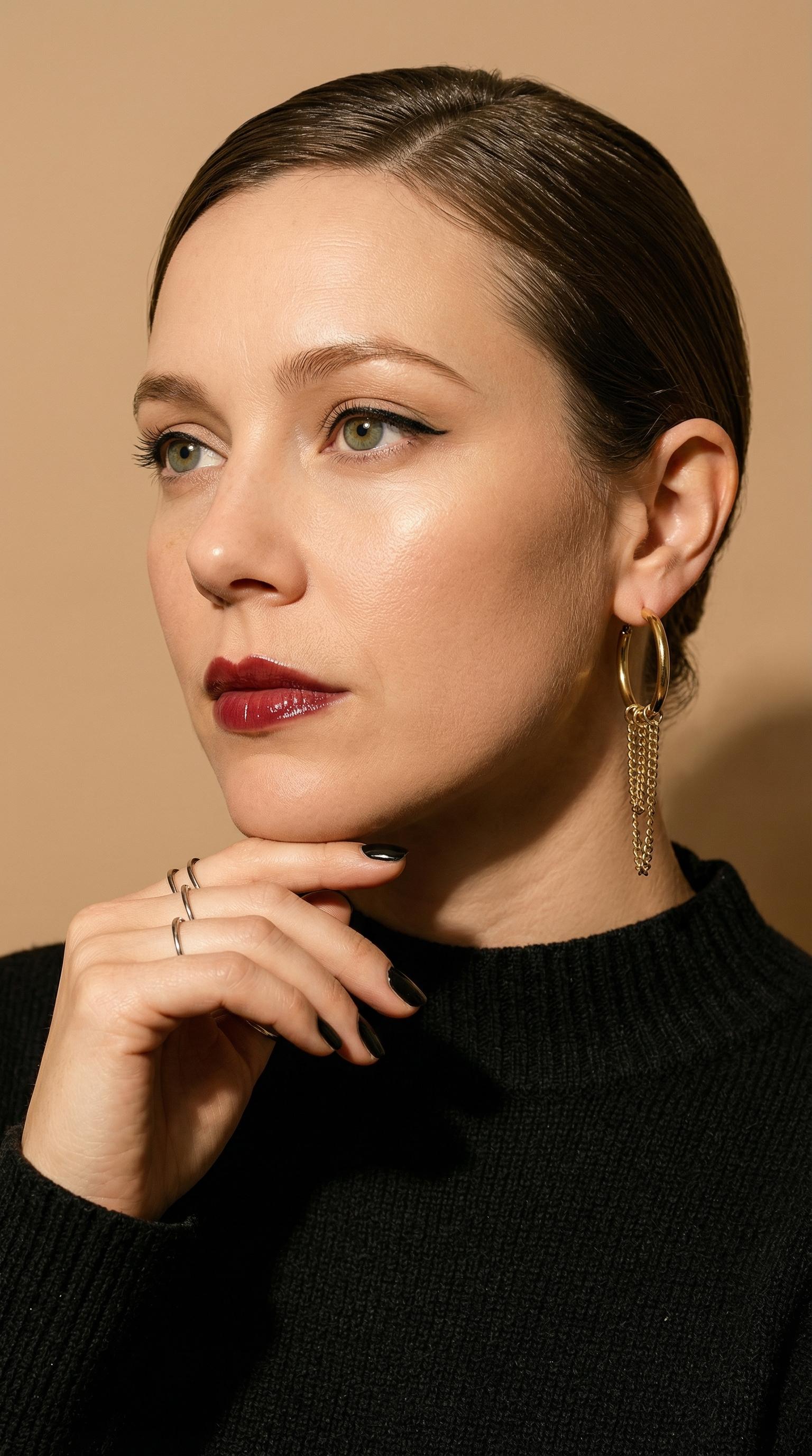Elegant Woman Slicked Hair Glossy Lips Thoughtful Gaze