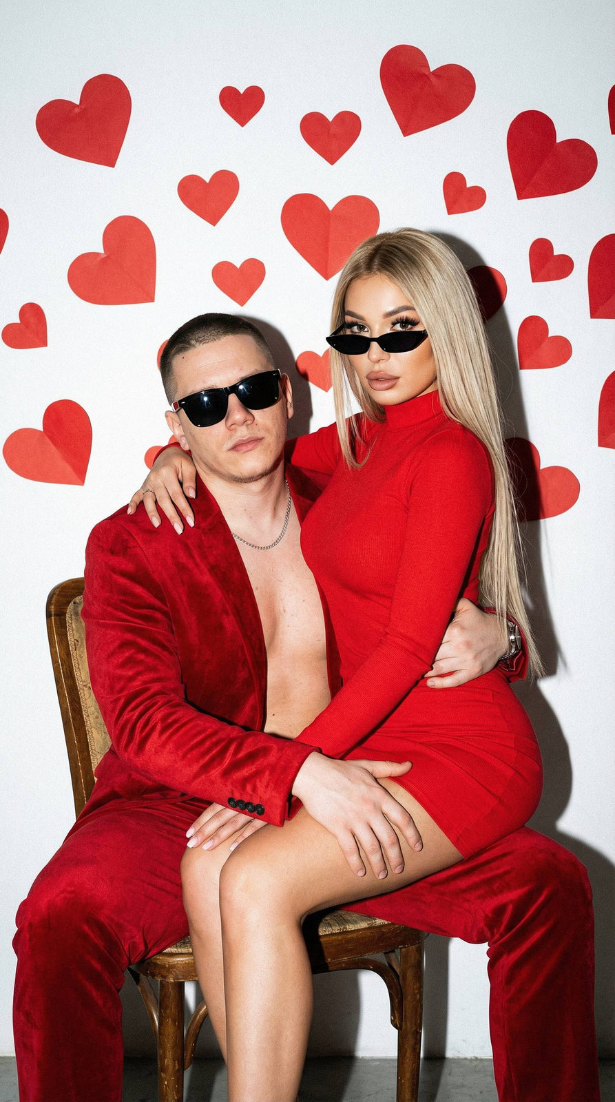Man Red Suit Girl Red Dress White Wall
