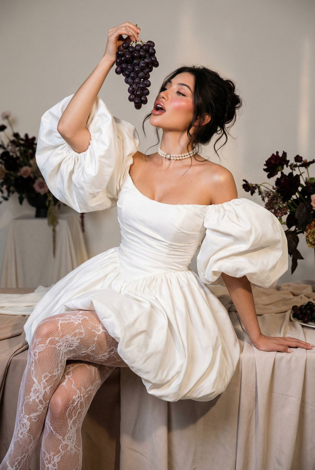 Elegant Woman Grapes Studio Portrait