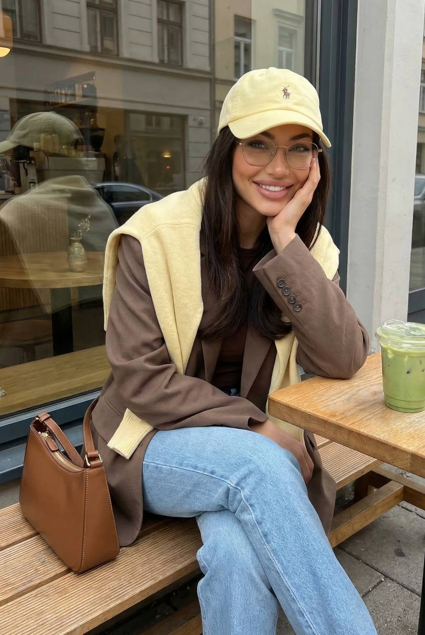 Outdoor Cafe Table Brown Blazer Yellow Sweater