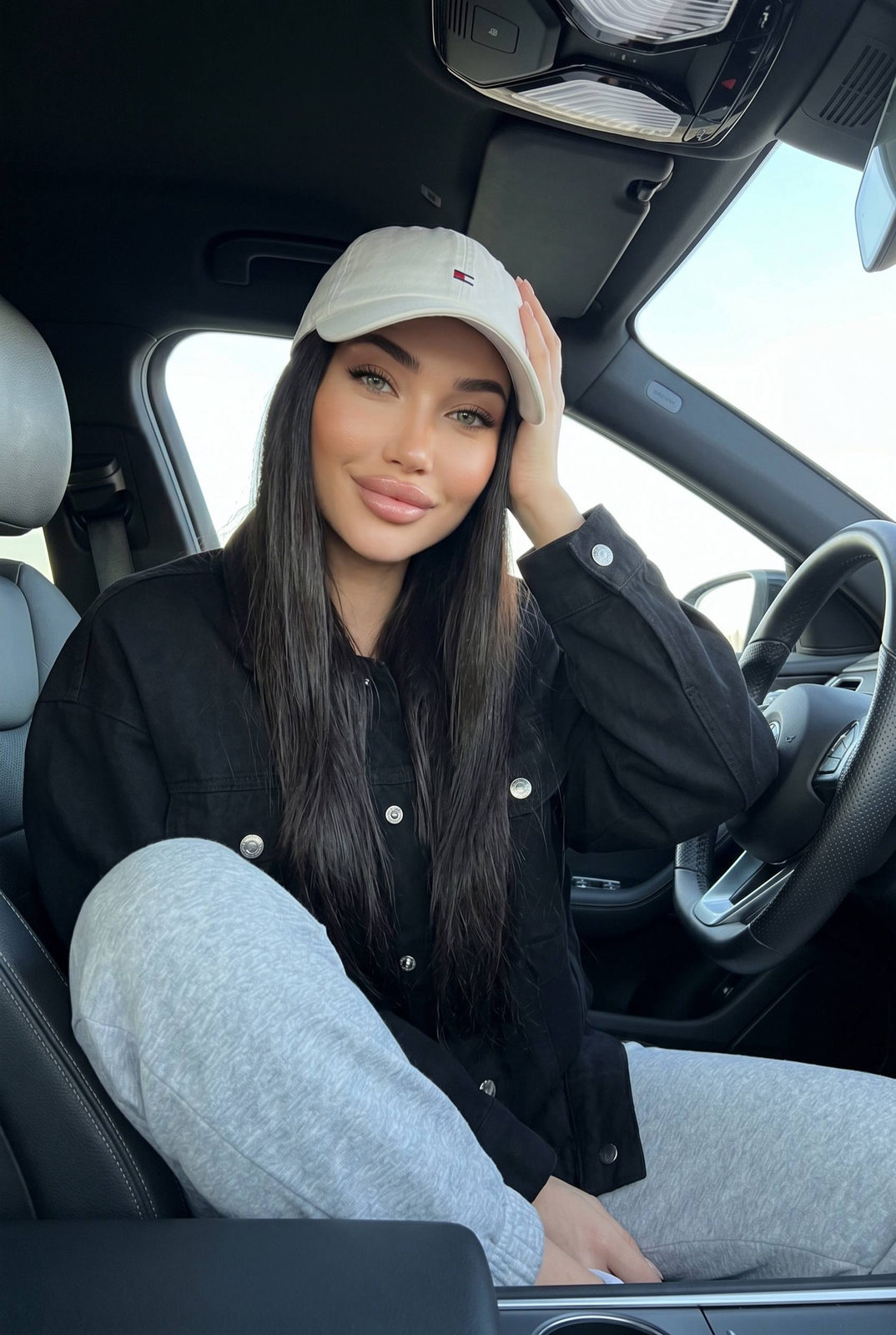 Car Relaxed Pose White Cap Black Jacket