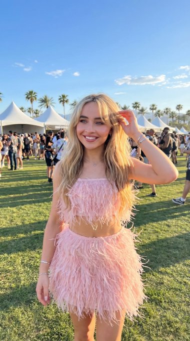 Feathered Festival Outfit Grassy Field Palm Trees