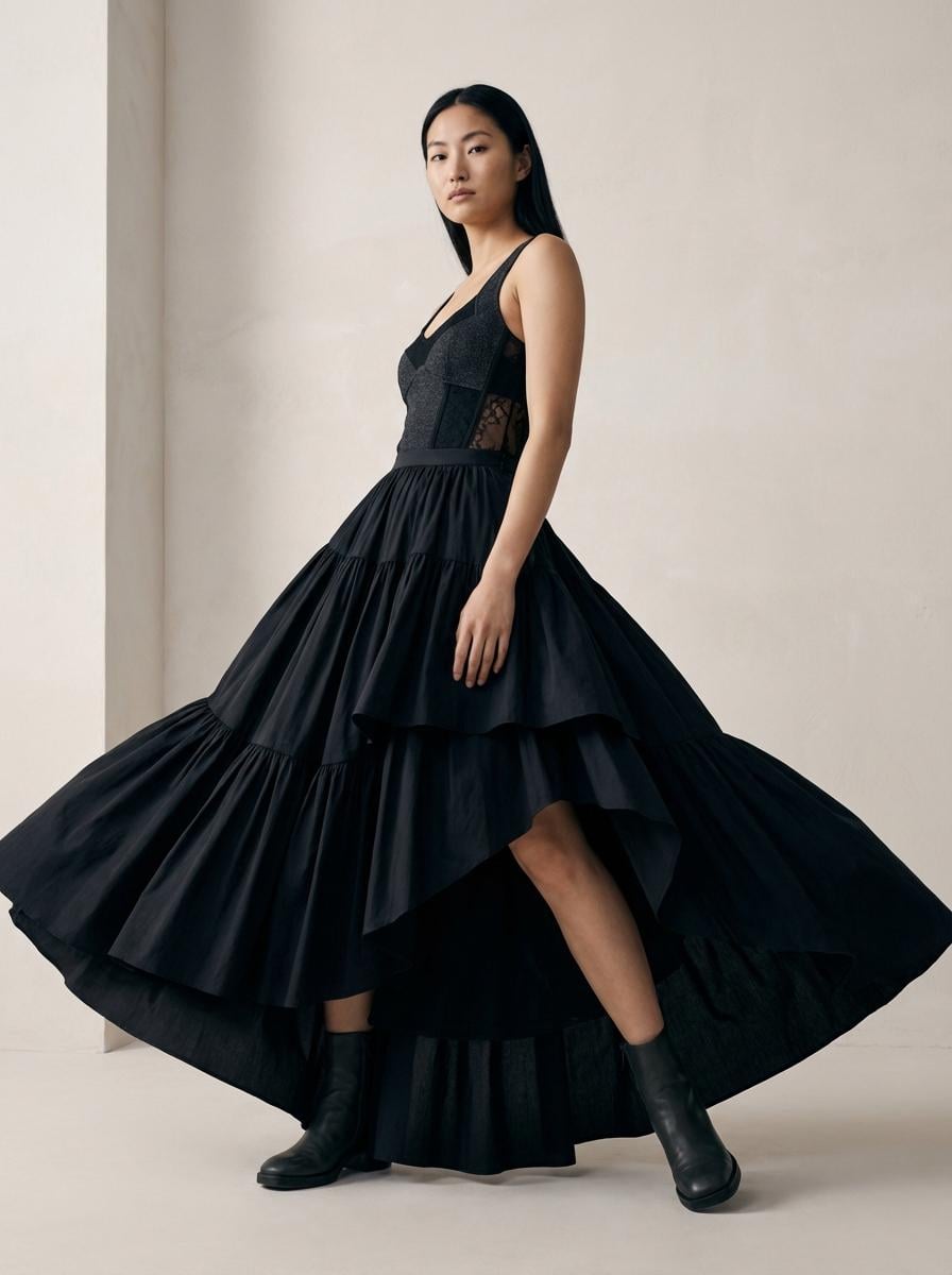 Tiered Black Gown Dynamic Pose Neutral Wall