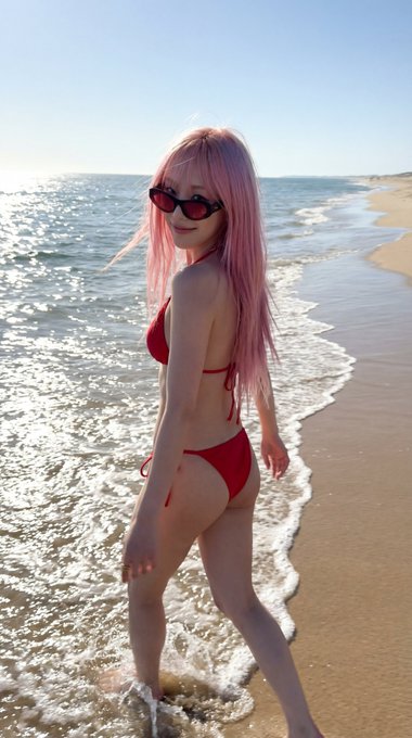 Red Bikini Walking Shoreline Late Afternoon Playful Smile