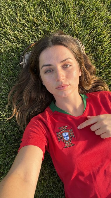 Pointing At Polo Crest On Green Grass