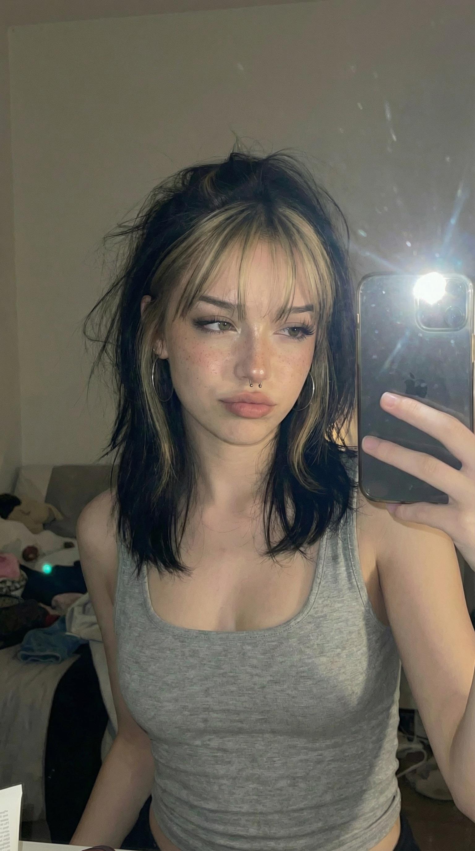 Realistic Selfie Dimly Lit Room Cluttered Bed reference photo