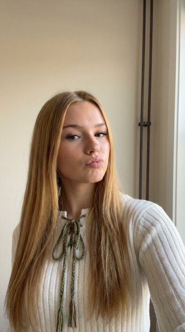 Cream Knit Sweater Playful Pout Soft Light Beige Wall