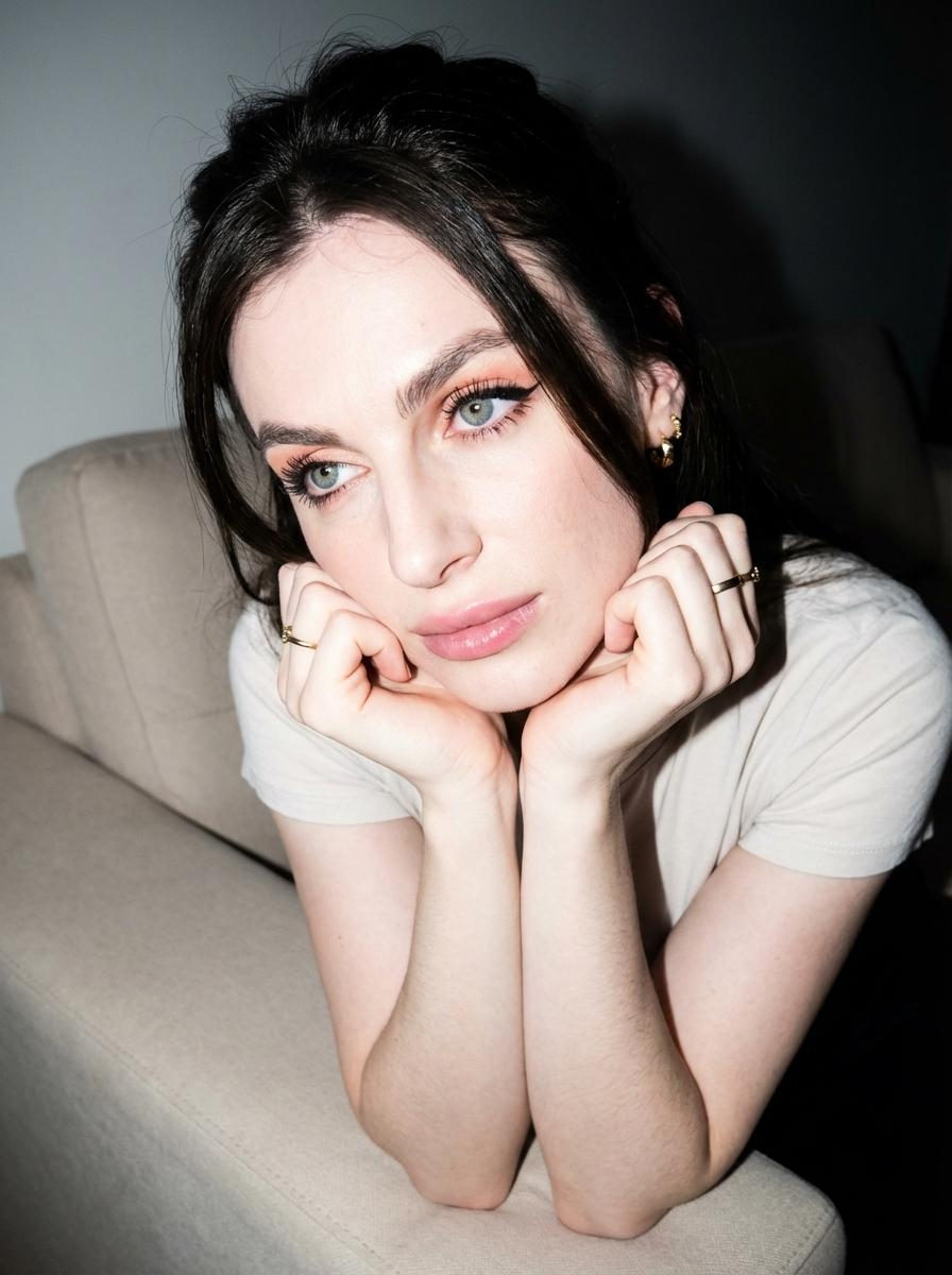 Thoughtful Woman Sofa Pose Pastel Eyeshadow Close Up