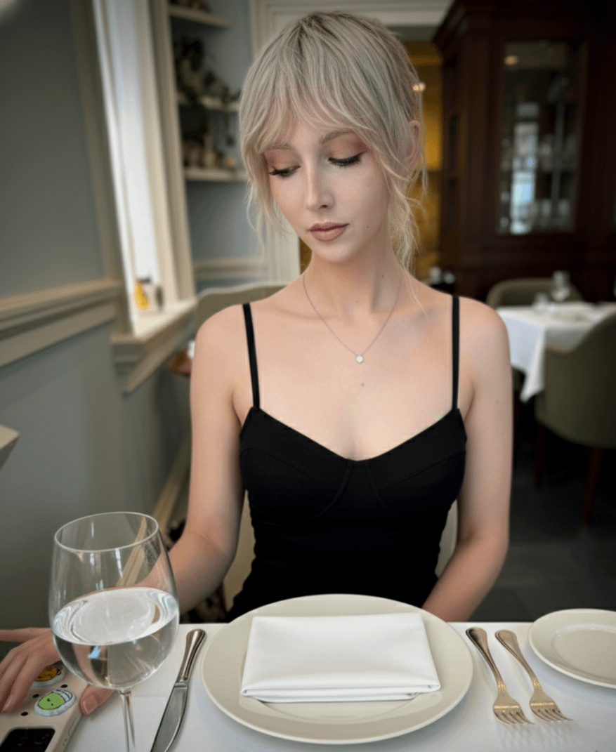 Seated At White Clothed Table In Restaurant Wears Black Spaghetti reference photo